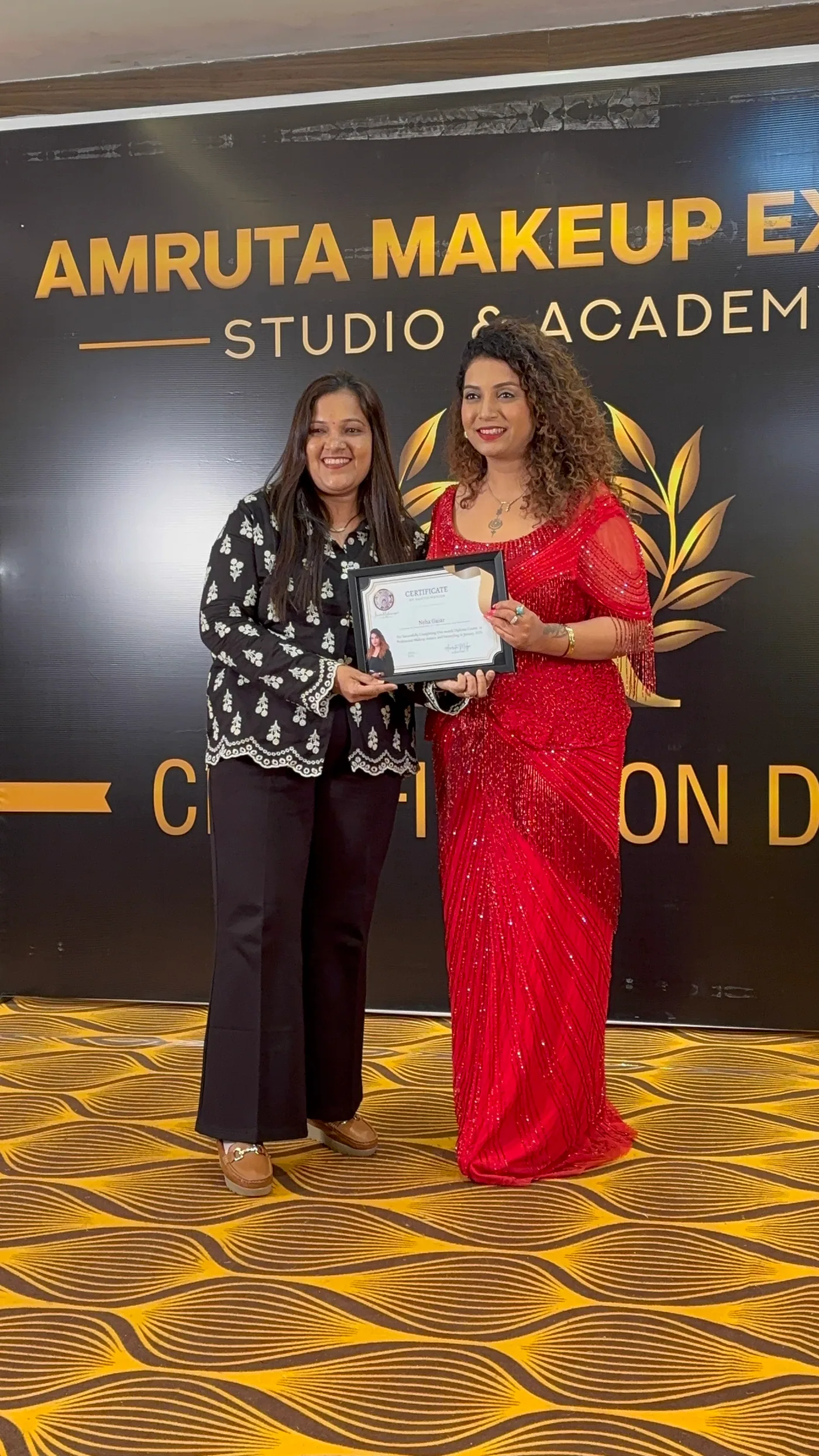 Neha receiving her diploma at Amruta Makeup Expert certification day