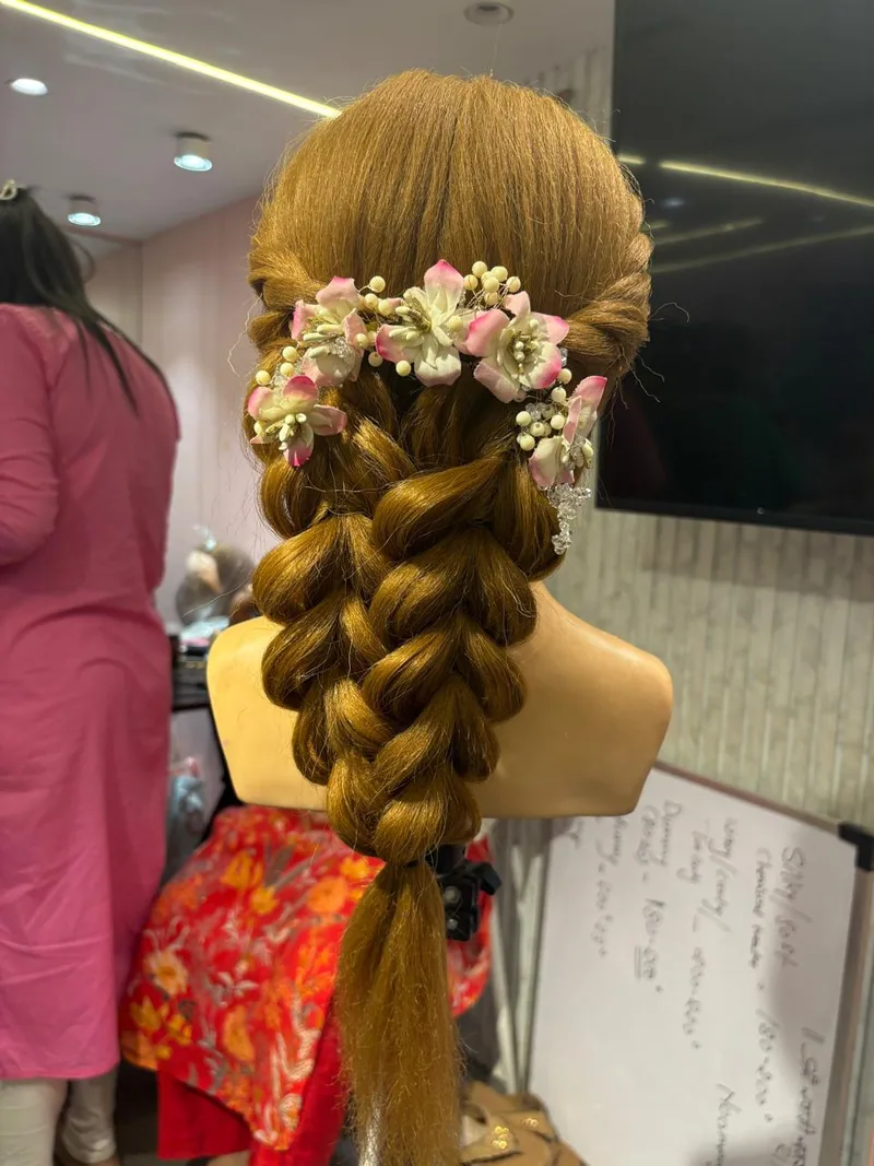 Braided bridal hairstyle practised on a mannequin head