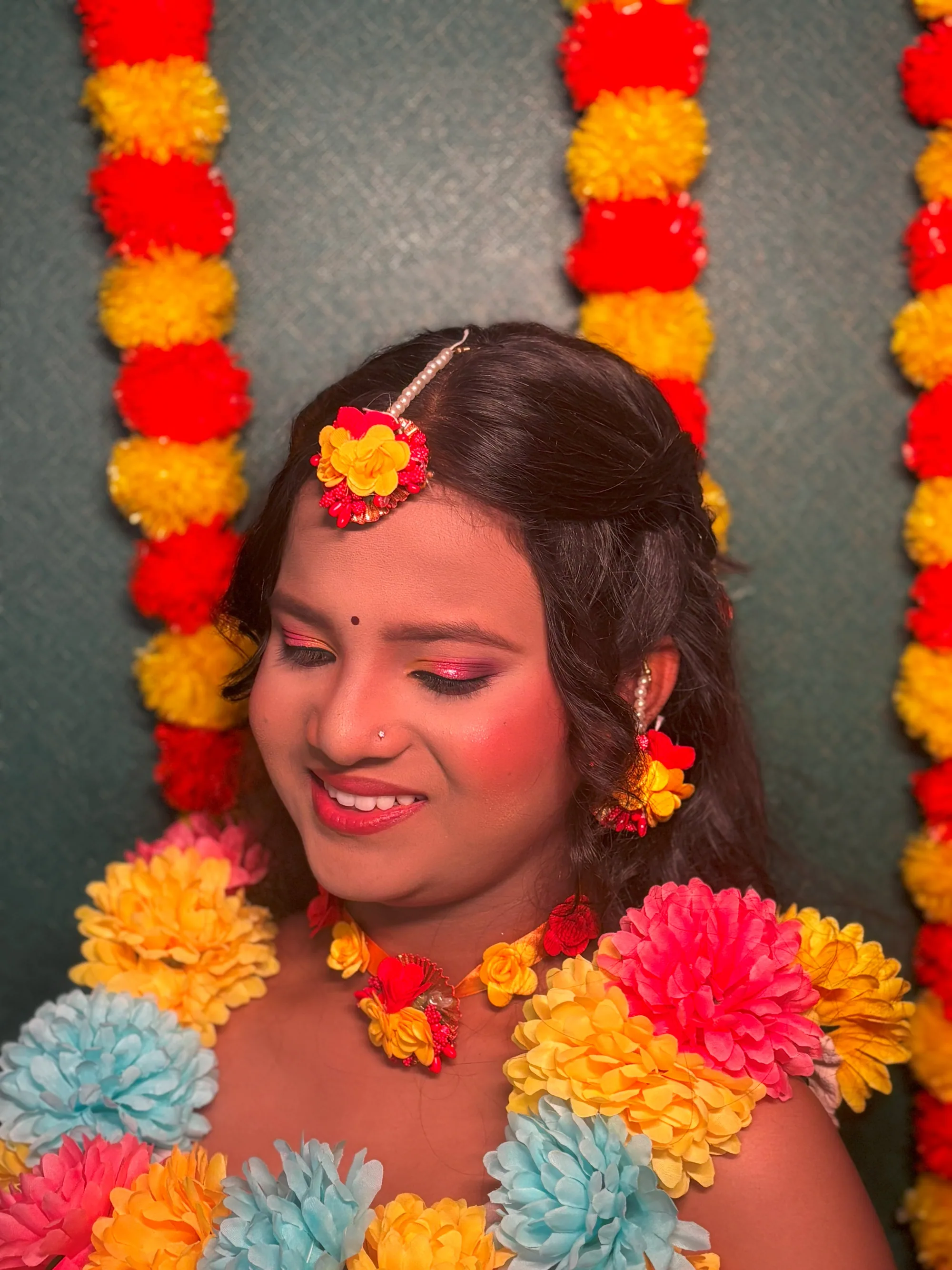 Haldi look with marigold garlands and floral jewellery