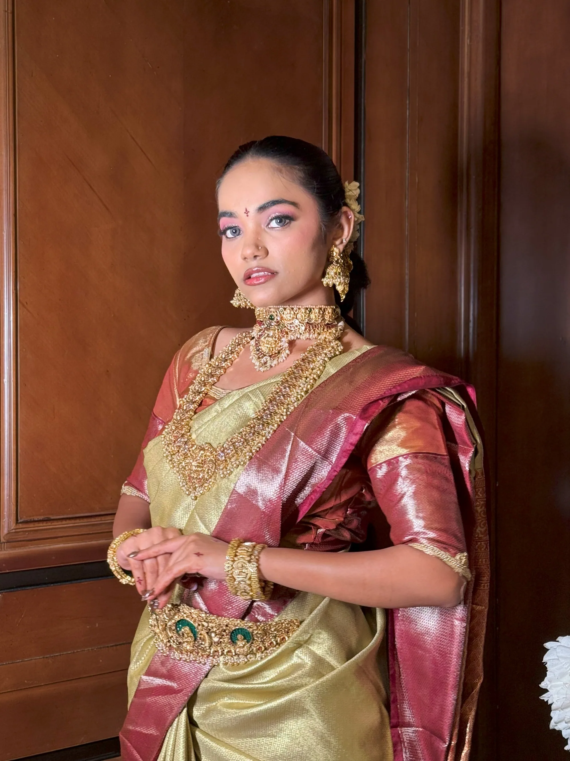 Gold tissue bride with layered temple jewellery