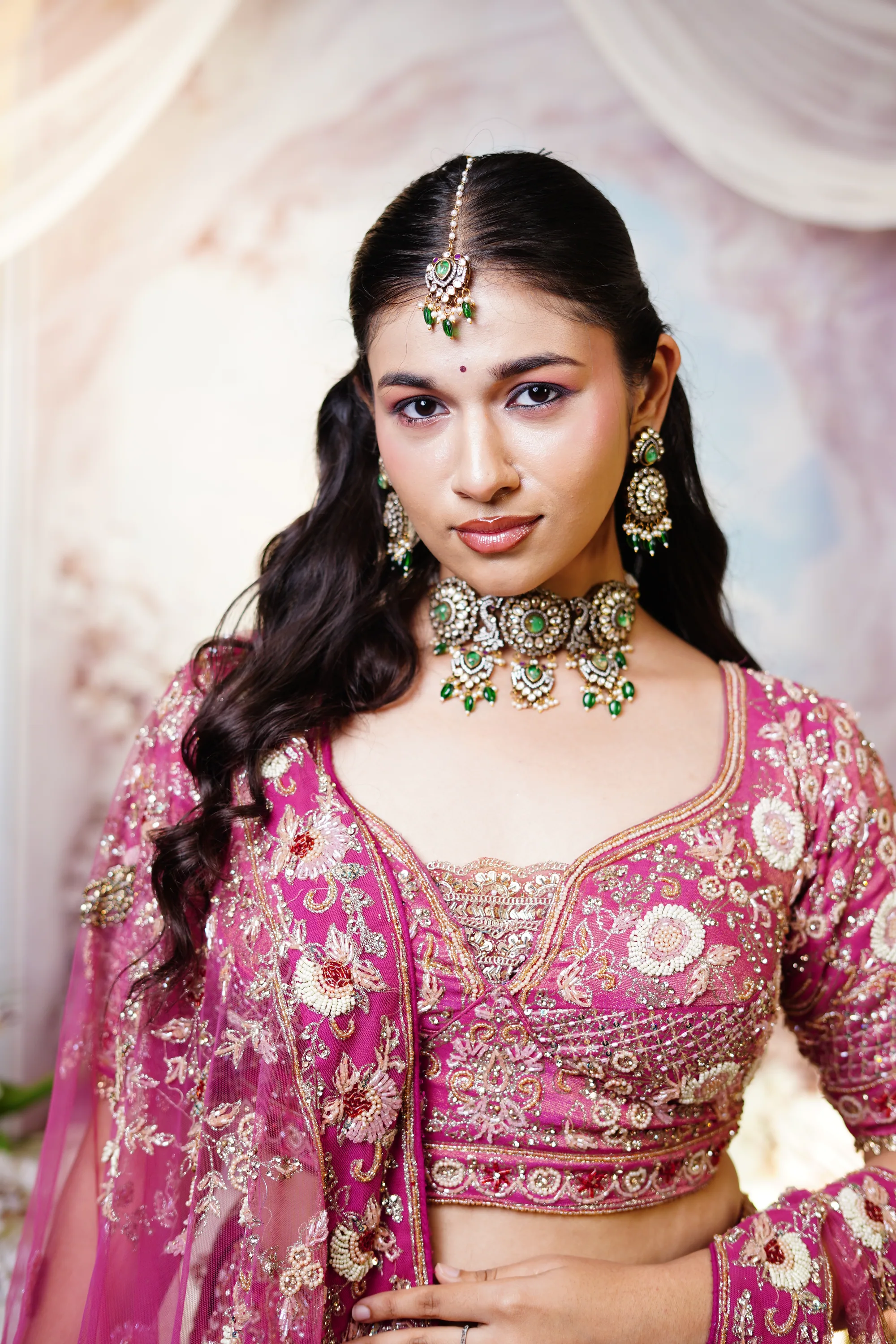 Bridal portrait with maang tikka and green kundan choker