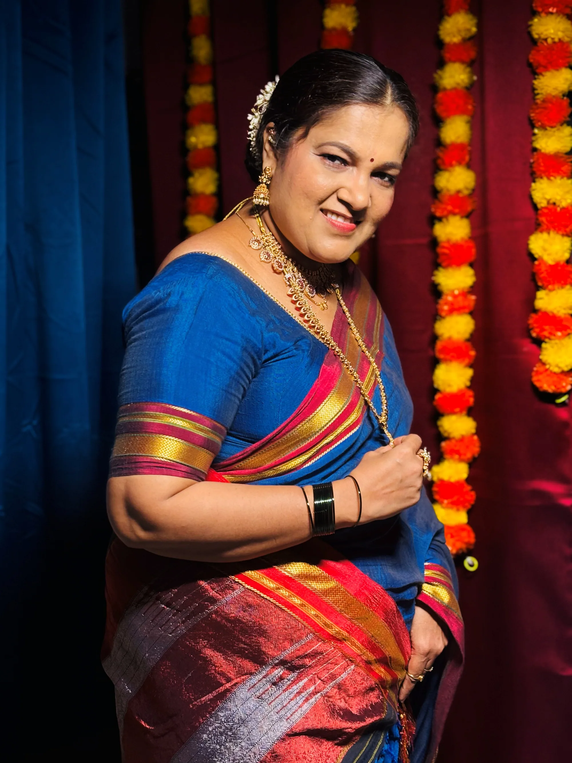 Mature client in a blue Maharashtrian silk saree